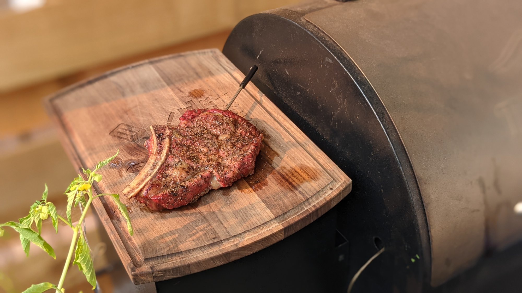 Grass-finished bone-in steak resting on a cutting board